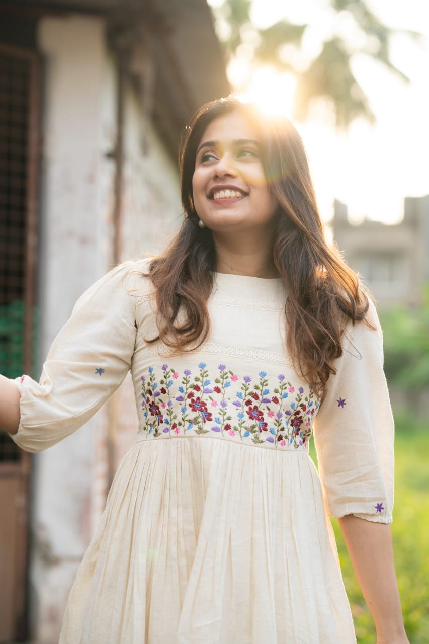 Off-white cotton dress with floral embroidery kurti
